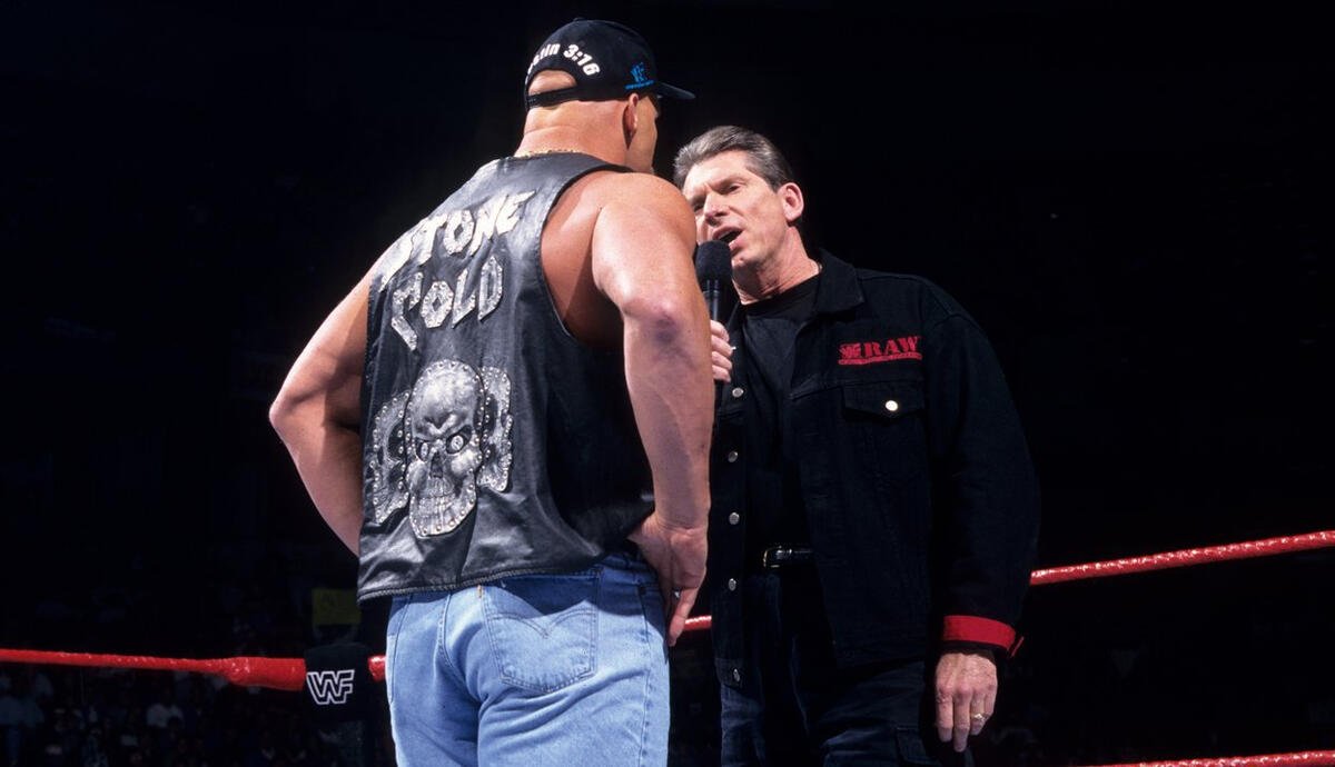 Stone Cold Steve Austin confronts Vince McMahon in the WWE raw news ring
