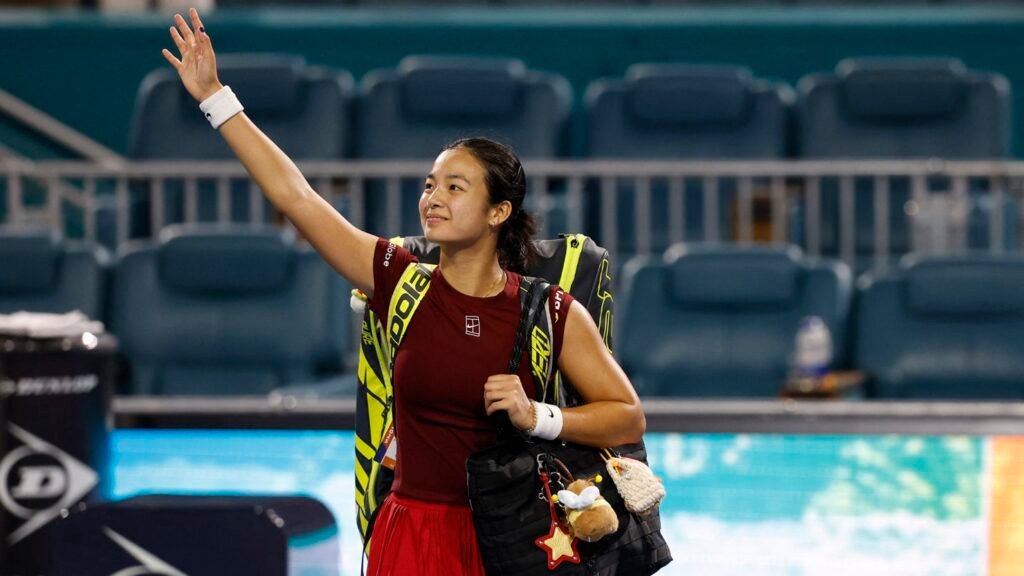  Alex Eala and Iga Świątek shaking hands at the net after their Miami Open match.