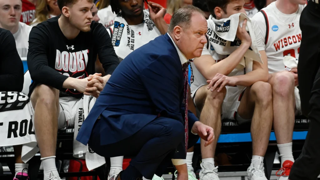 Wisconsin basketball players reacting to a shocking loss in the NCAA Tournament 2025.