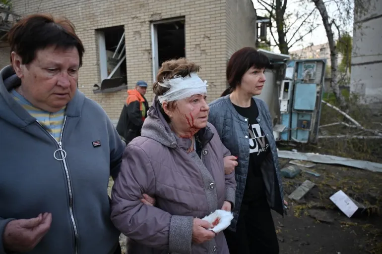 Displaced Ukrainian civilians receiving aid and shelter after drone attacks
