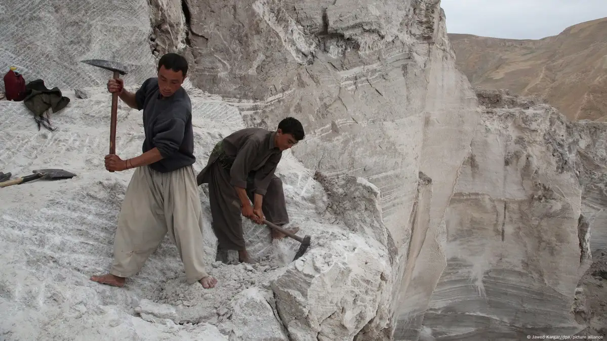 Open-pit lithium mine in Afghanistan with heavy machinery