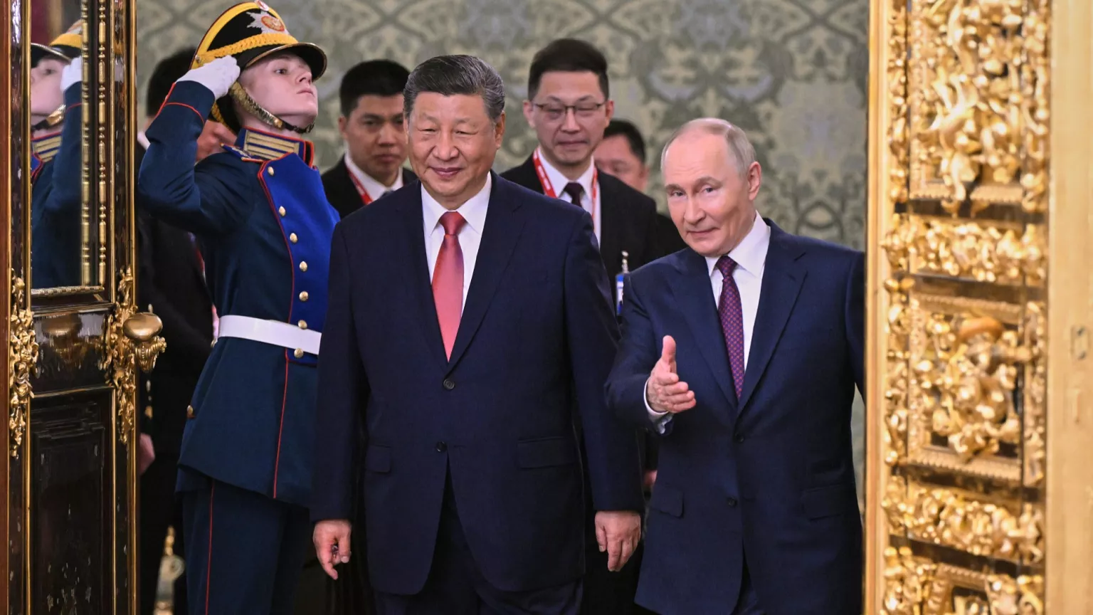 Xi and Putin smiling during a formal welcome ceremony