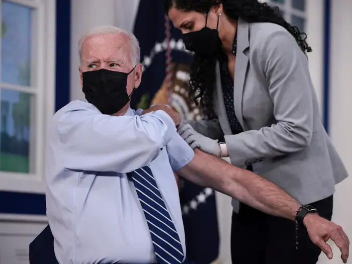 Joe Biden visiting a hospital or speaking with healthcare professionals