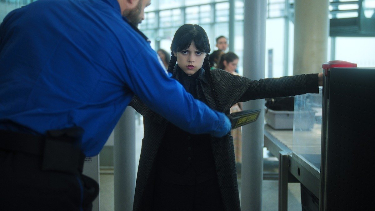 Wednesday Addams airport scene in Wednesday Season 2 trailer with her signature gothic suitcase