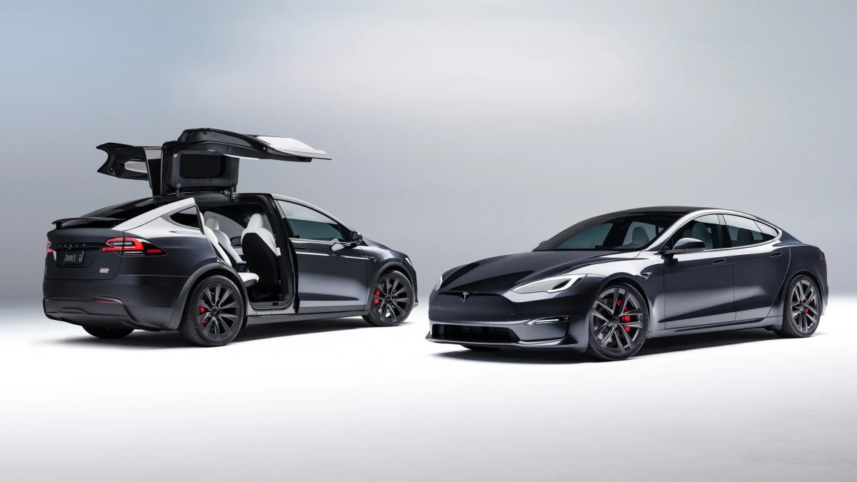 “Tesla Model X electric SUV with falcon-wing doors open”